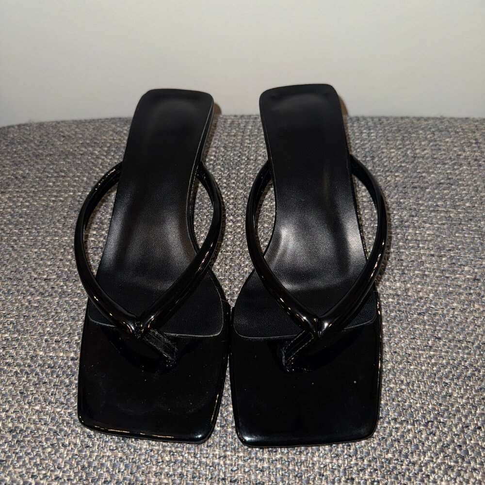 Black latex, open toe kitten heel. Flip flop style